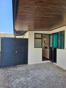 a house with a wooden ceiling and a garage at Roof Loft Cerca de Poliforum in León +15 photos