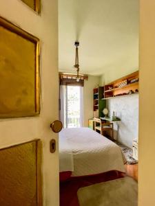 a bedroom with a bed and a window at Apartment Navigator's lodging in Kotor