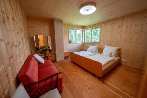 a living room with a couch and a window at Villa Zirbenherz in Gotha