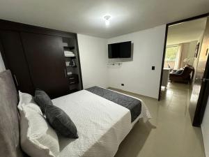 TV a/nebo společenská místnost v ubytování Apartamento Nuevo Laureles- La 70