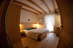 Posteľ alebo postele v izbe v ubytovaní Agritur Renetta