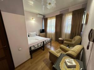 Ένα ή περισσότερα κρεβάτια σε δωμάτιο στο ALEM Hotel
