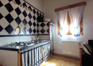 A kitchen or kitchenette at Apartamentos Rurales Azabal