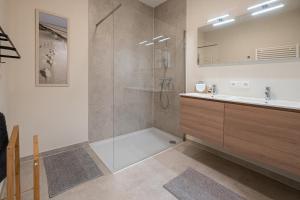 a bathroom with a shower and a sink at Vakantie-B'lankenberge The One in Blankenberge +26 photos