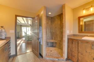 a bathroom with a shower with a sink and a toilet at Peaceful Big Sandy Home with Deck on Kentucky Lake! in Big Sandy +24 photos