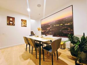 a dining room with a table and chairs at Eden - Fast & Furious 伊甸园 - 速度与激情 in Adelaide