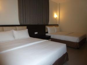 Postel nebo postele na pokoji v ubytování Hotel Hong