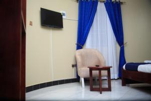 A television and/or entertainment centre at Nesa Resort Kampala