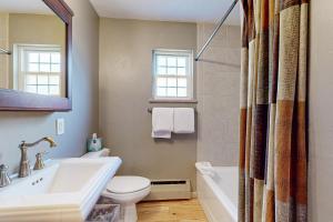 a bathroom with a tub and a toilet and a sink at East Vail Getaway in Vail +23 photos