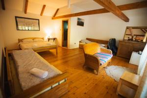 a living room with a bed and a couch at GRAB ethno village and camp in Šćepan-Polje