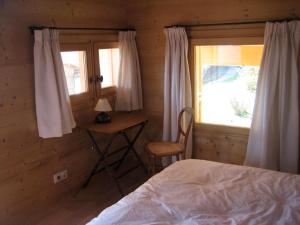Ένα ή περισσότερα κρεβάτια σε δωμάτιο στο chalet classé 4 étoiles face aux Aravis plein sud 12 personnes
