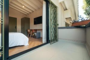 Voodi või voodid majutusasutuse Hotel Boutique Roomzz Laureles toas