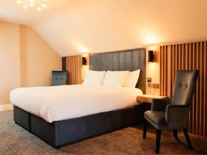Postel nebo postele na pokoji v ubytování Springfield Hotel