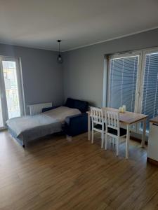 Posteľ alebo postele v izbe v ubytovaní Apartament Perła Kutna