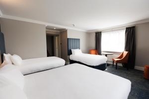 Postel nebo postele na pokoji v ubytování Springfield Hotel