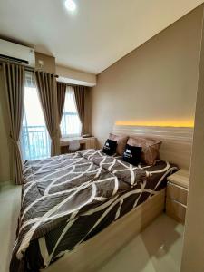 Postel nebo postele na pokoji v ubytování Sleep Room transpark Cibubur