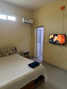 Un pat sau paturi într-o cameră la Hospedaria do Adoço /Adoço Guesthouse