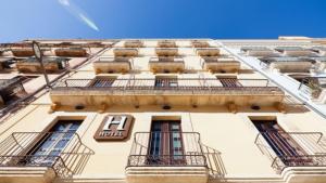 a building with balconies on the side of it at Plaça De La Font in Tarragona