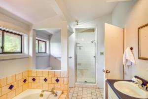 a bathroom with a tub and a shower and a sink at 3 Mi to Ski Slopes Park City Retreat with Game Room in Park City +30 photos