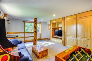 a living room with a couch and a table at 3 Mi to Ski Slopes Park City Retreat with Game Room in Park City