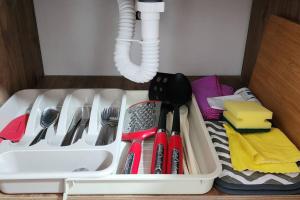 a white tray filled with utensils on a table at Casa de las Palmas 2 in Guayaquil
