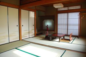 a rendering of a room with a table and chairs at Tiny GuestHouse Umekoji 梅小路 in Kyoto