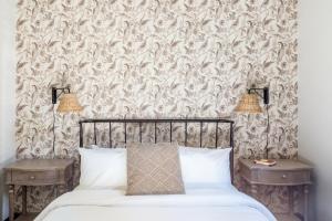 a bedroom with a bed and two nightstand tables at Inn at Gough in San Francisco