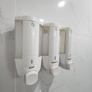 a row of white routers on a wall at Cozy Hideaway in Thorold +24 photos