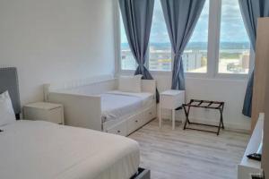 Ένα ή περισσότερα κρεβάτια σε δωμάτιο στο Apartamentos LUXURY Carolina PR