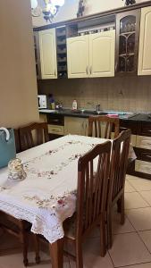 a kitchen with a table with a table cloth on it at Lucas apartaments in Vlorë