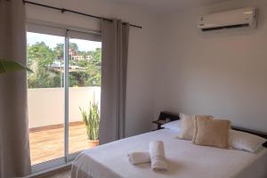 Voodi või voodid majutusasutuse Habitaciones con amplia terraza a minutos del centro toas