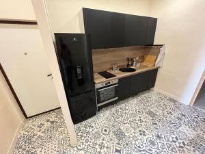 a kitchen with a sink and a counter at Place aux Aires in Grasse