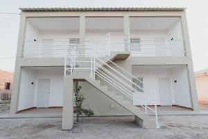 a house with a staircase on the side of it at Las Moras Del Manantial in Termas de Río Hondo +21 photos