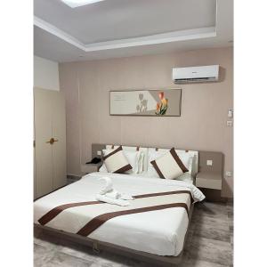 Postel nebo postele na pokoji v ubytování Milennium Hotel Nouadhibou