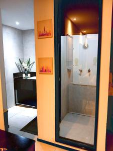 a shower in a room with a glass door at Luxury Paiva Flat in Recife