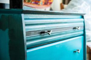 a blue chest of drawers with metal pulls at 6min to city centre - Cosy & Quiet Vintage Retreat in Christchurch
