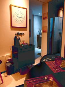 a living room with a table and a picture on the wall at Luxury Paiva Flat in Recife
