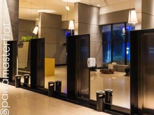 a lobby of a building with a phone booth at Luxury Paiva Flat in Recife