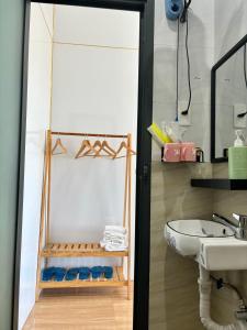 a bathroom with a sink and a mirror at Homestay Vitamin SEA - View Biển Phú Quý in Cu Lao Thu