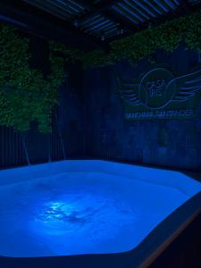 a hot tub in a dark room with a sign at Casa Iris Hotel Boutique in Barichara