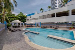 a swimming pool in front of a building at Cartagena - Torremarina in Cartagena de Indias