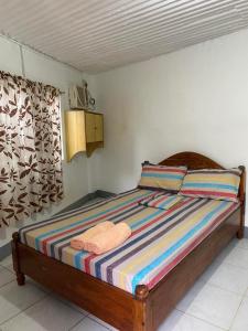 Postel nebo postele na pokoji v ubytování Em's Homestay