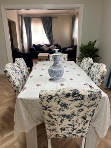 a table with a vase sitting on top of it at جاردن سيتى in Cairo