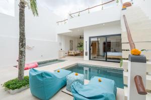 a house with a swimming pool and a living room at Villa Sawahku - 2 Bedrooms Private Villa with Rooftop and View in Canggu +55 photos