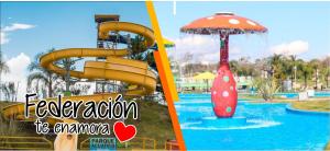 un parco acquatico con scivolo e ombrellone di SyS Departamento a Federación