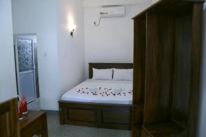 Postel nebo postele na pokoji v ubytování Emerald Coast Hotel Negombo