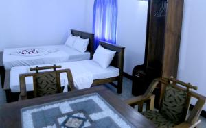 Postel nebo postele na pokoji v ubytování Emerald Coast Hotel Negombo