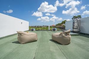 two pillows sitting on top of a roof at Villa Flambard in Canggu