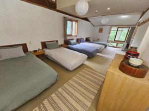 Postel nebo postele na pokoji v ubytování Yamadasan Ski Lodge - Madarao + 21 fotografií