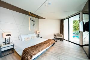 Ein Bett oder Betten in einem Zimmer der Unterkunft Mera Mare Pattaya